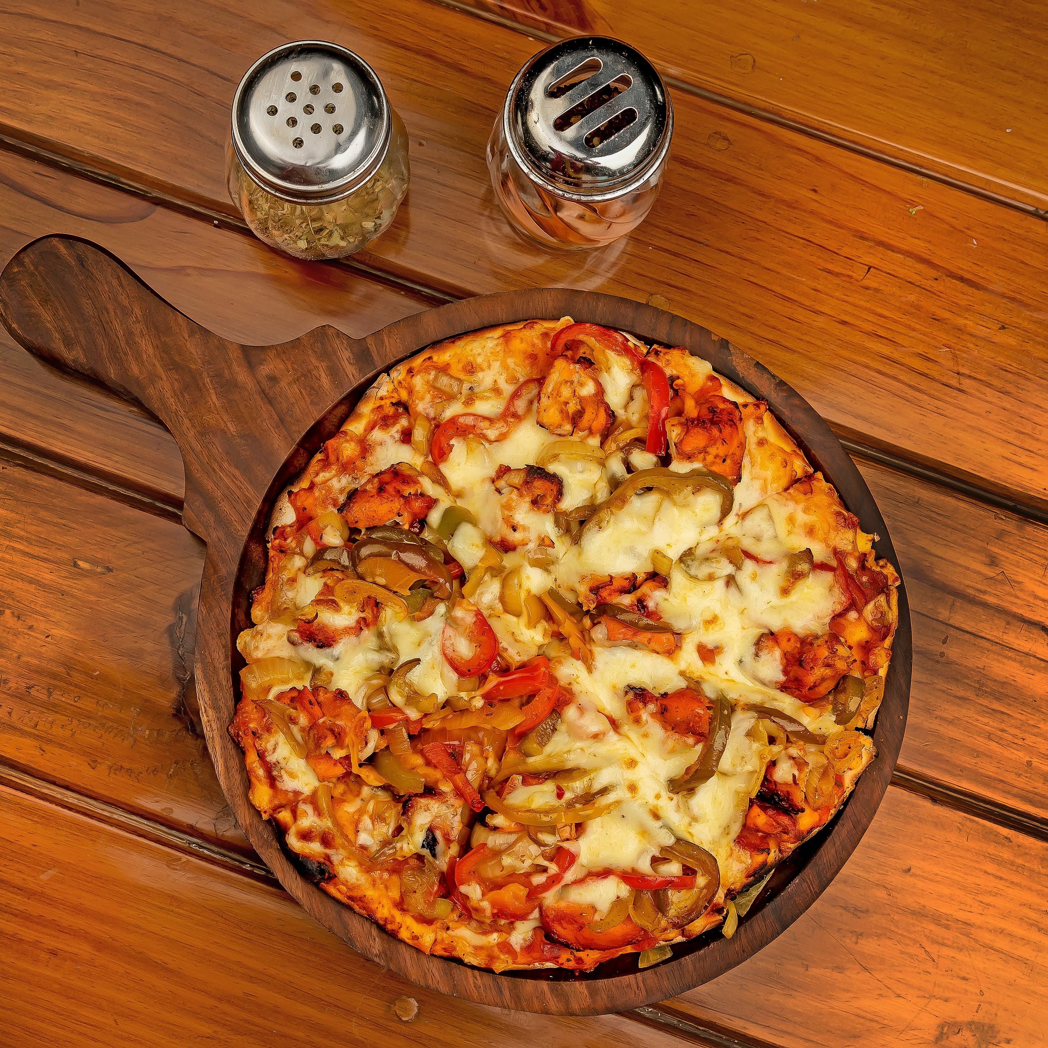 Try the famous Elevate Your Pizza Game with this Indian-style Veggie Pizza Recipe! featured in Dalmaa Elevate Your Pizza Game with this Indian-style Veggie Pizza Recipe!